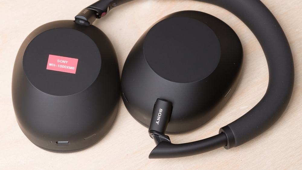 The sealed ear cups of the Sony WH-1000XM6, a pair of premium closed-back headphones.